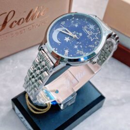 Reloj de dama scottie,pulso metalico acerado de broche,diseño lunas y estrellas.